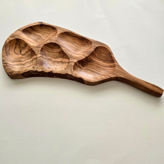 Wooden serving board with 5 compartments on a light background