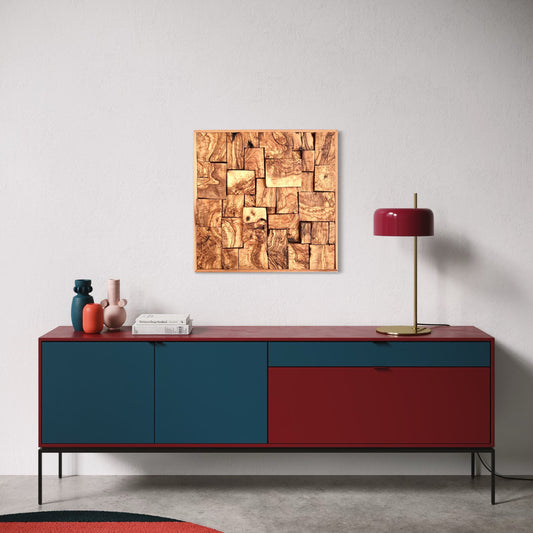 Modern sideboard with red and blue design, lamp, and abstract art on a white wall.
