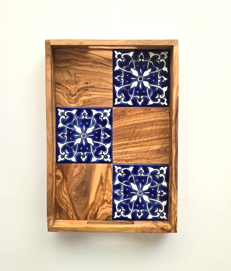 Wooden tray with blue and white tiled patterns on a white background